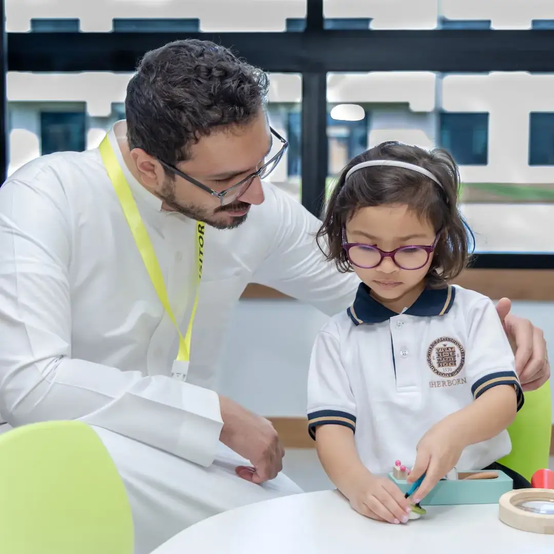 Sherborne School Jeddah teacher and student in a lesson.