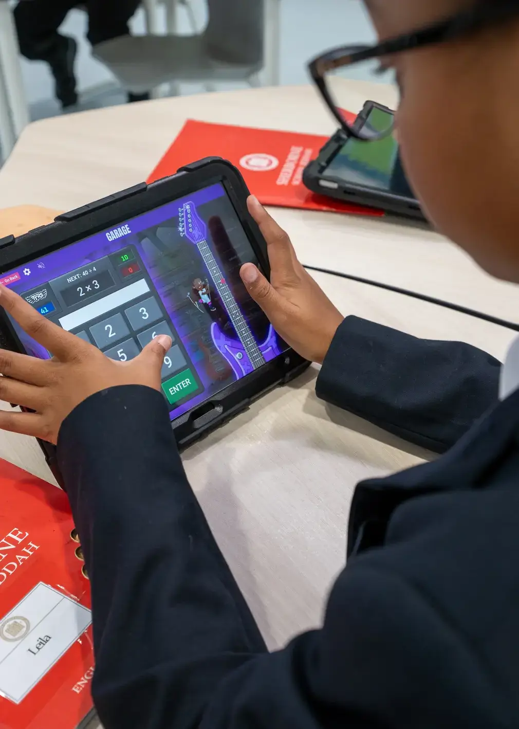 Sherborne School Jeddah student using a tablet in a maths lesson.