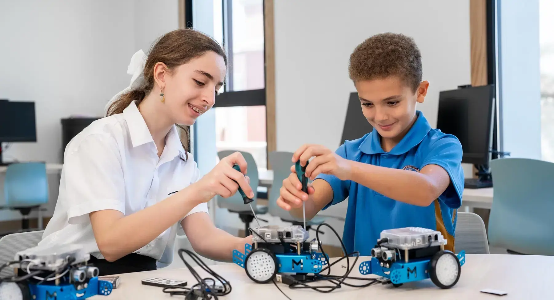 Sherborne School Jeddah students building robotic cars.