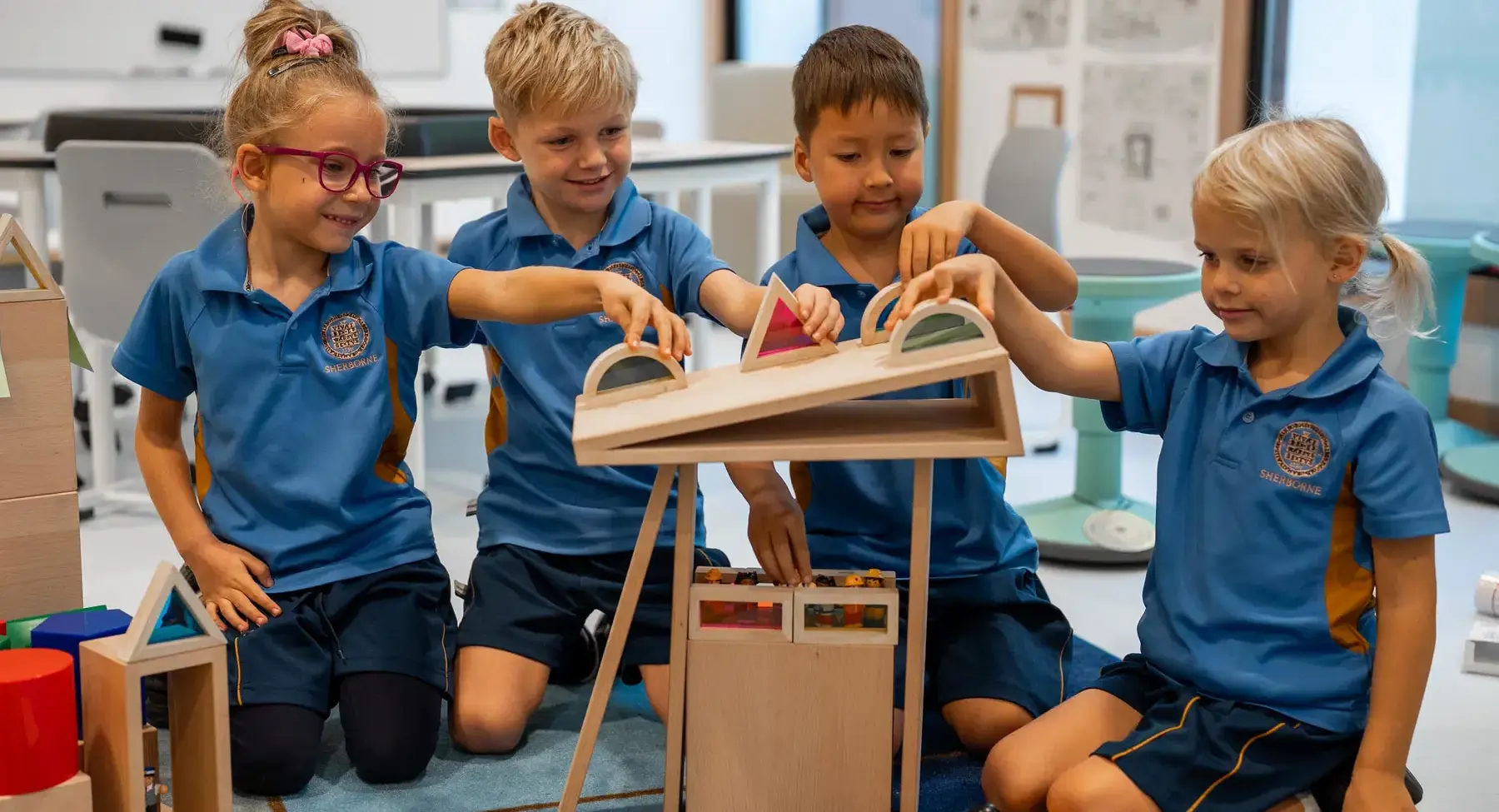 Students engaging on a building blocks activity