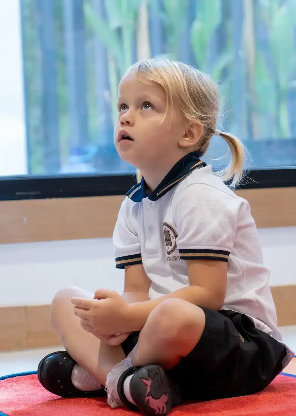 Sherborne School Jeddah student sitting and listening in a lesson.