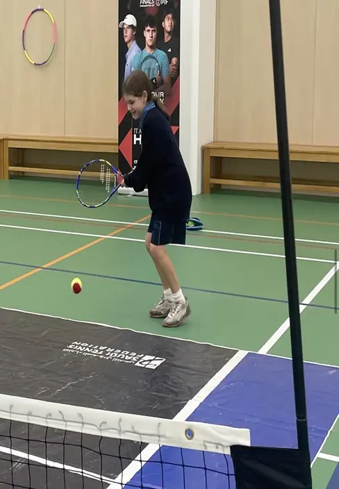 Sherborne School Jeddah student playing tennis.