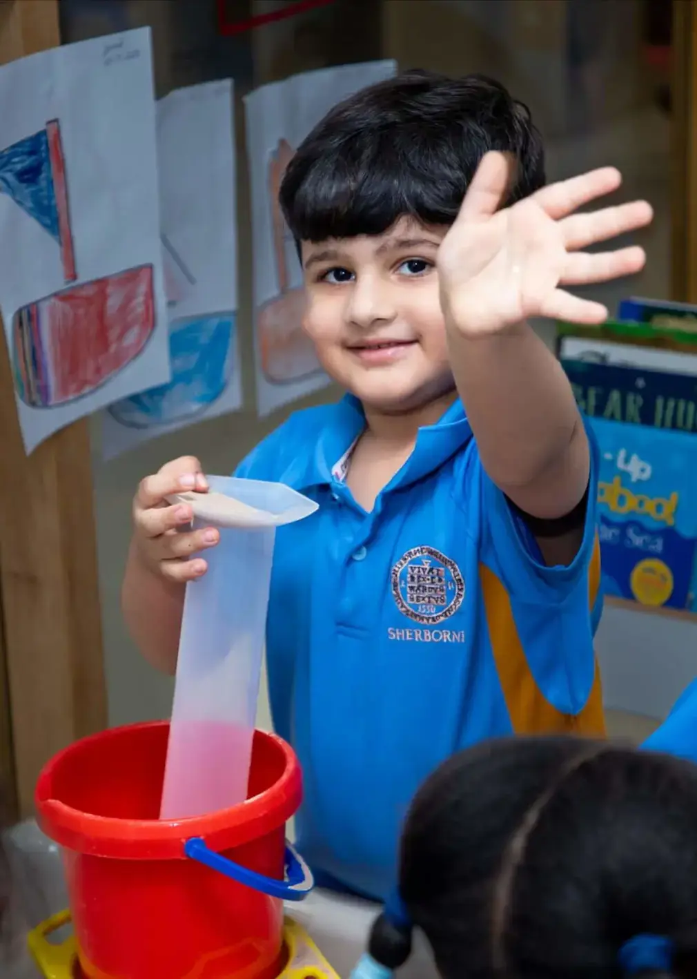 Sherborne Jeddah pupil playing at a sand box