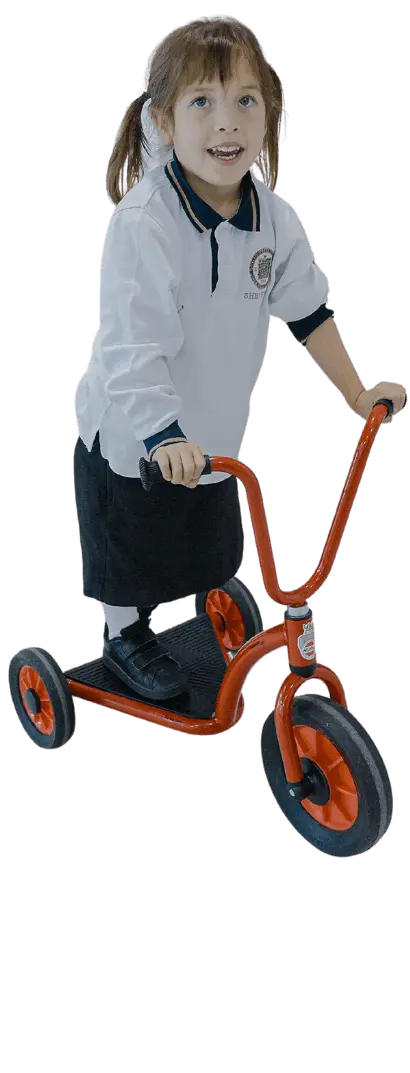 Sherborne Jeddah student playing on a trike
