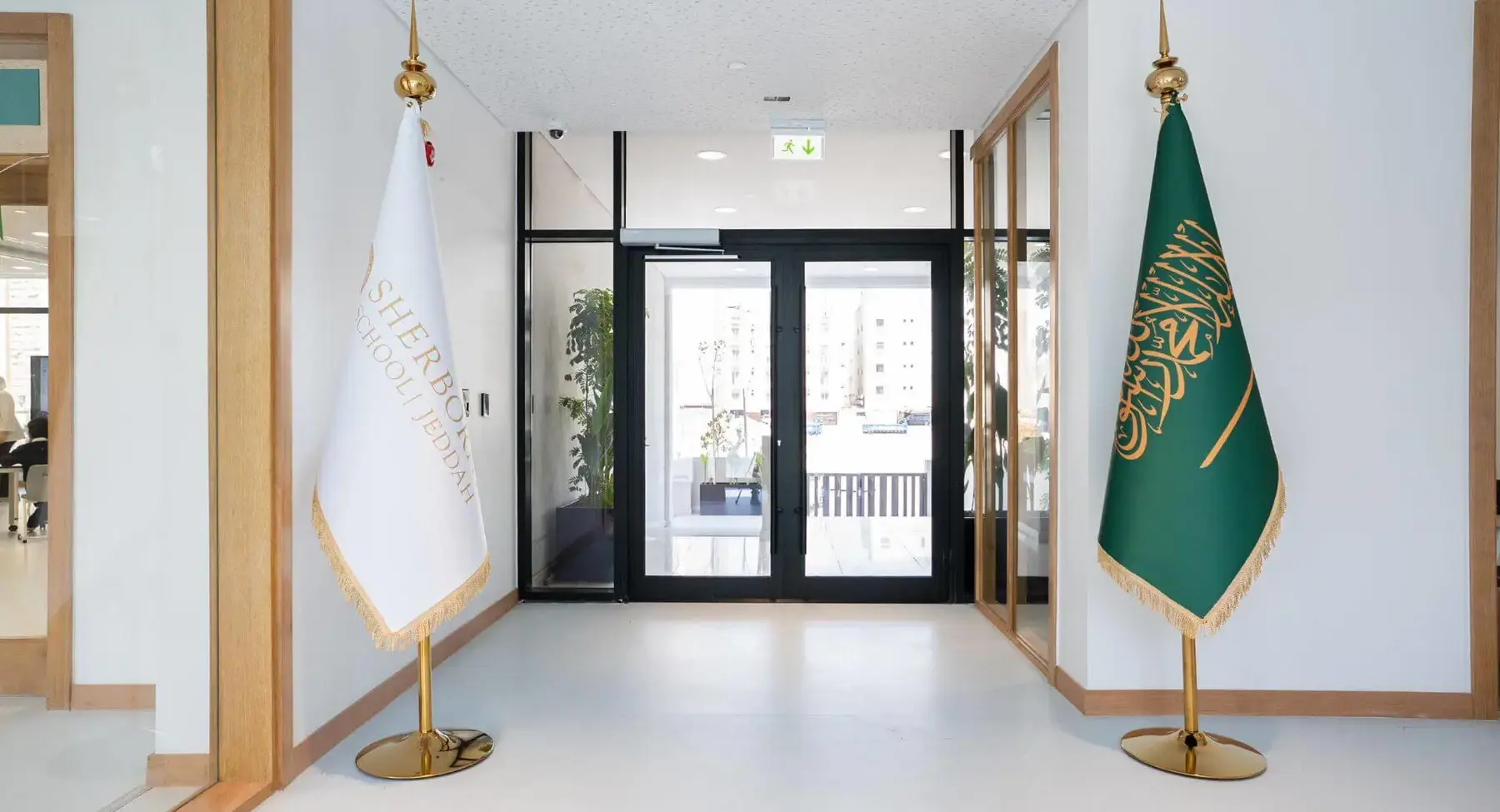 Sherborne School Jeddah hallway with flags.