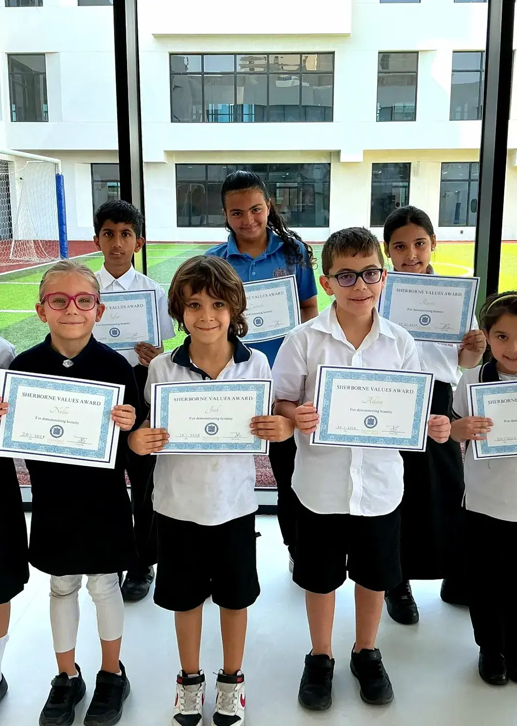 Sherborne School Jeddah students with Values Awards certificates.