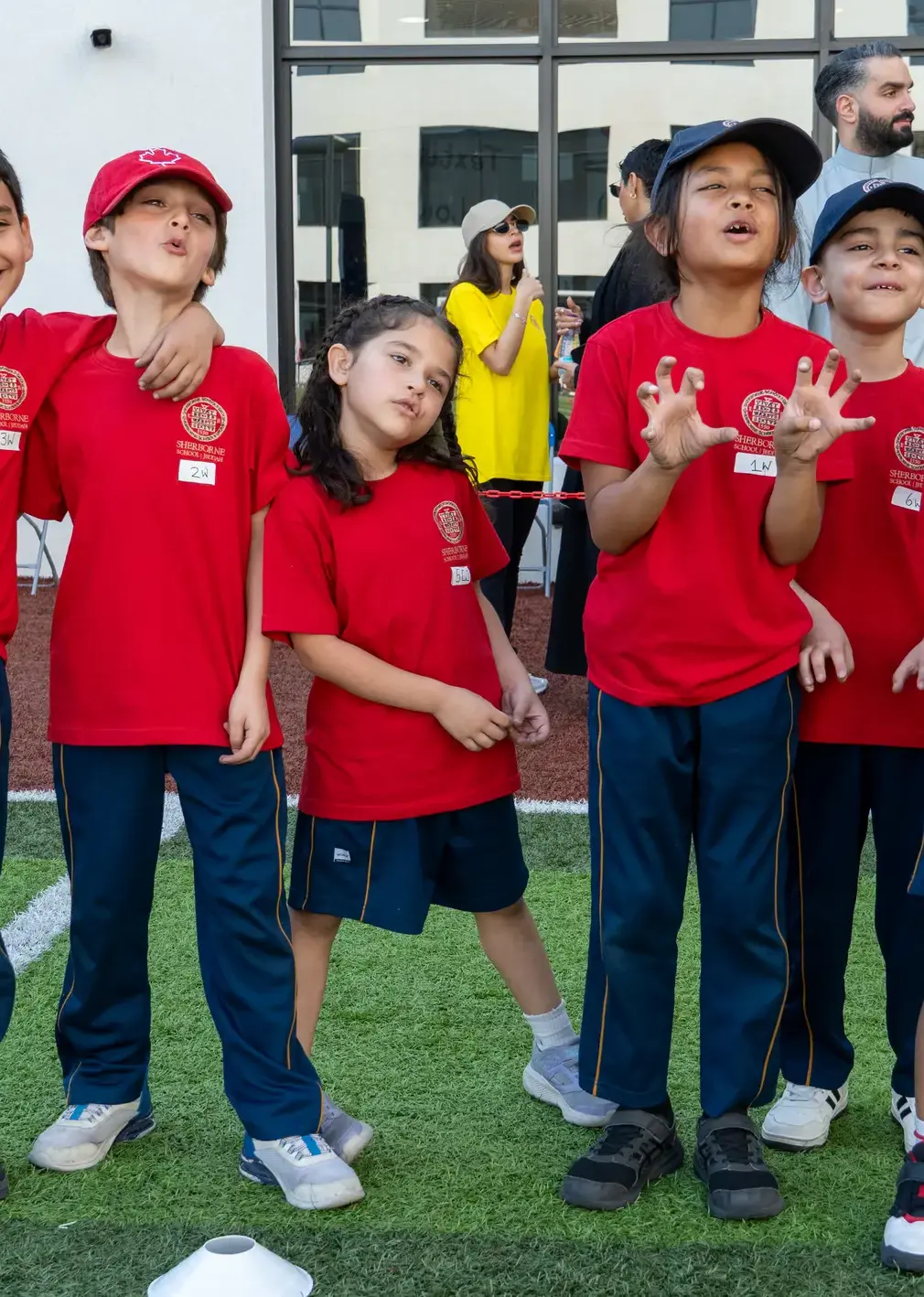 Sherborne School Jeddah students wearing red t-shirts on sports day.