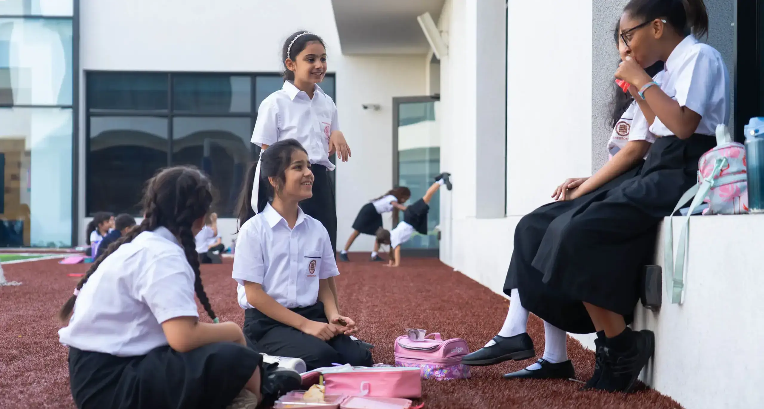 Sherborne School Jeddah students eating lunch together.